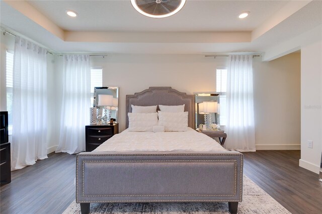 14007 Creek Harbor Dr, Orlando, FL 32824 - bedroom featuring a raised ceiling, recessed lighting, baseboards, and dark wood-style flooring