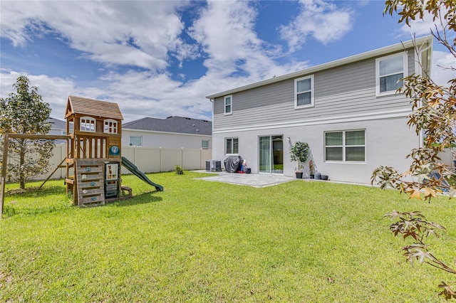 14007 Creek Harbor Dr, Orlando, FL 32824 - rear view of house with fence, a yard, a playground, central air condition unit, and a patio area