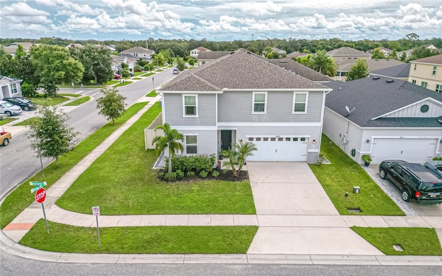 14007 Creek Harbor Dr, Orlando, FL 32824 - view of front of property featuring a residential view, a front yard, an attached garage, and driveway