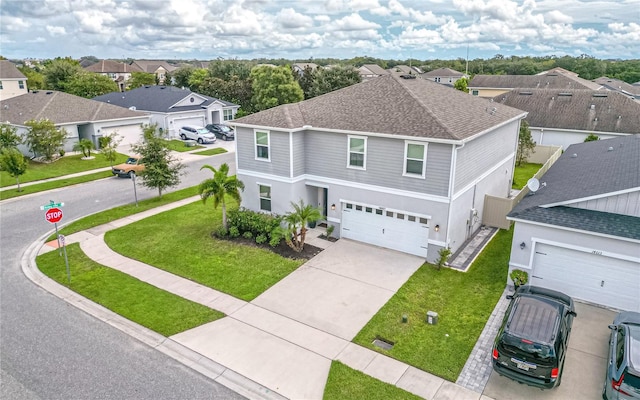 14007 Creek Harbor Dr, Orlando, FL 32824 - traditional-style house featuring driveway, a shingled roof, a residential view, an attached garage, and a front yard
