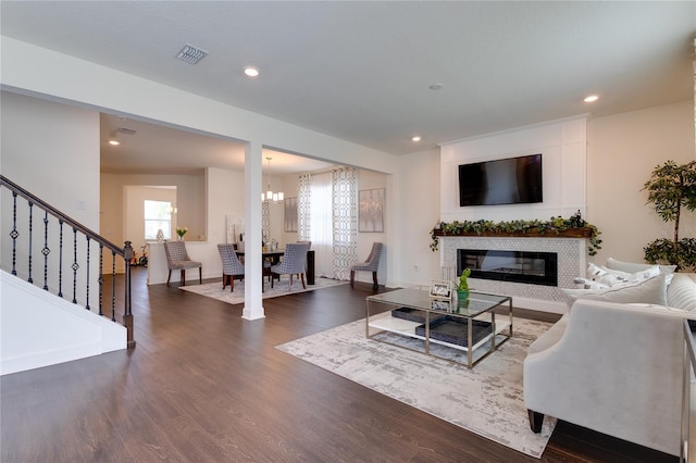 14007 Creek Harbor Dr, Orlando, FL 32824 - living room with dark wood finished floors, visible vents, a healthy amount of sunlight, and stairway