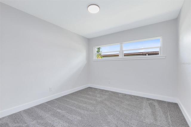 unfurnished room with carpet floors