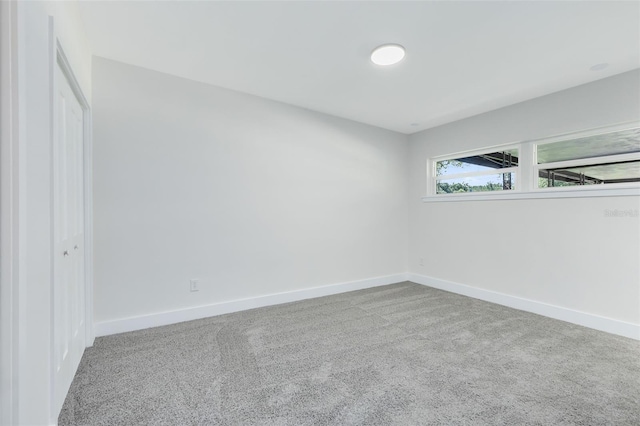 unfurnished room featuring carpet floors