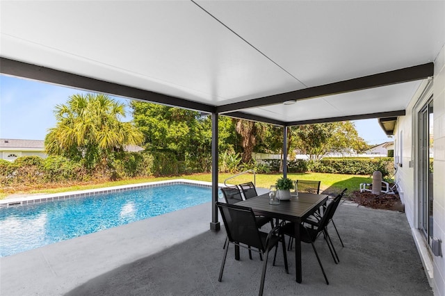 view of pool featuring a lawn and a patio