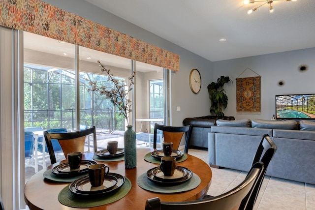 dining room with light tile patterned floors and a healthy amount of sunlight