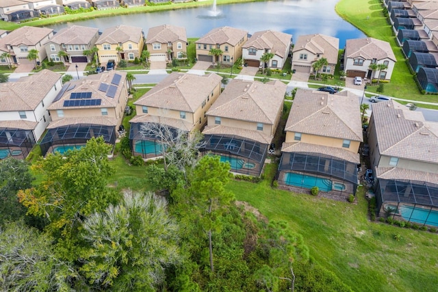 birds eye view of property with a residential view and a water view