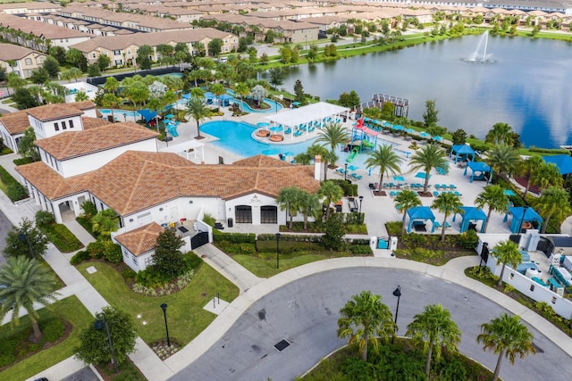 birds eye view of property with a water view