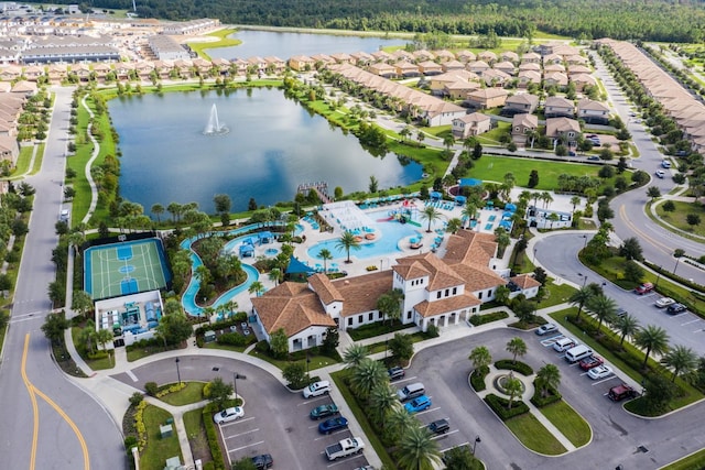 bird's eye view featuring a water view and a residential view