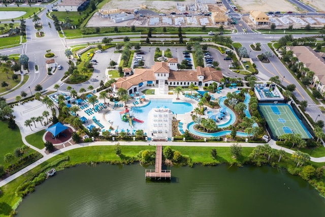 birds eye view of property with a water view