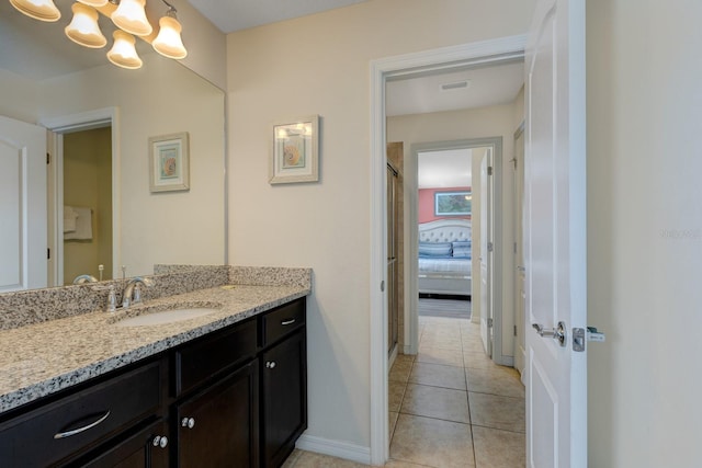 8804 Macapa Dr, Kissimmee, FL 34747 - full bathroom featuring vanity, a chandelier, and tile patterned flooring