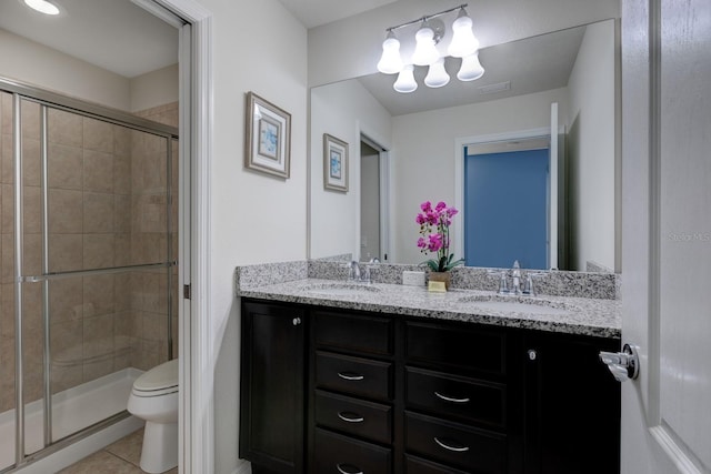 8804 Macapa Dr, Kissimmee, FL 34747 - bathroom featuring double vanity, a shower stall, tile patterned floors, and a chandelier