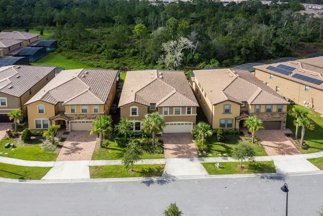8804 Macapa Dr, Kissimmee, FL 34747 - aerial perspective of suburban area with a heavily wooded area