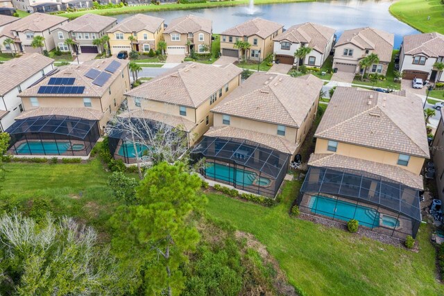 8804 Macapa Dr, Kissimmee, FL 34747 - aerial perspective of suburban area with a pool area and a large body of water