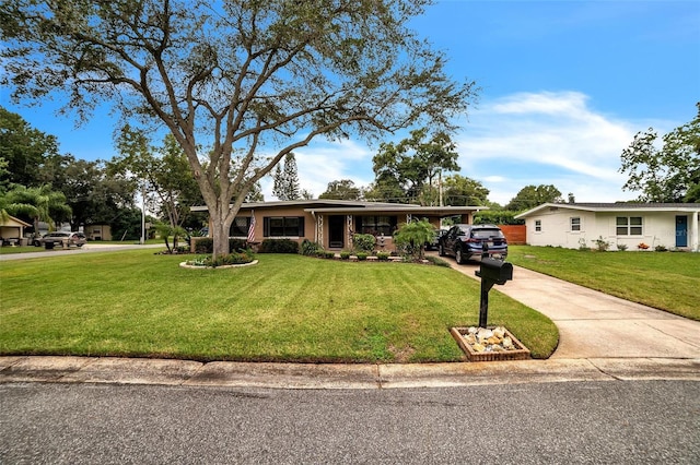 ranch-style home with a front lawn