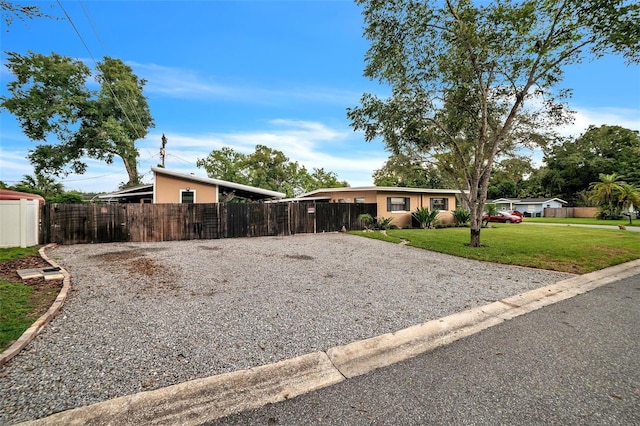 single story home with a front yard