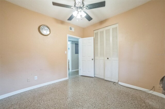 unfurnished bedroom with a closet and ceiling fan