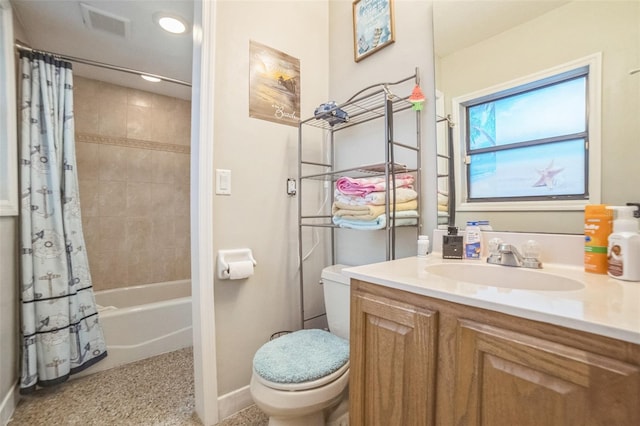 full bathroom featuring shower / bath combo with shower curtain, toilet, and vanity