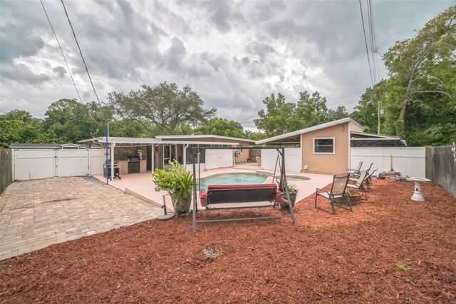 view of yard with a patio and a jacuzzi