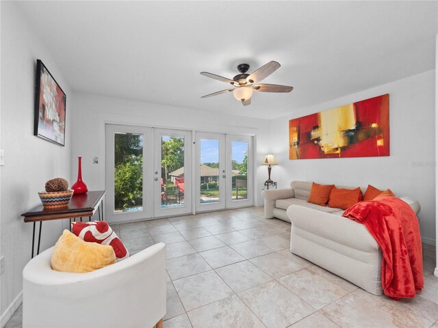 living room with ceiling fan, light tile patterned floors, and french doors