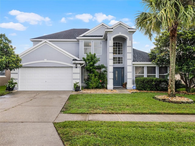 front facade with a garage and a front lawn