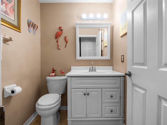 bathroom with tile patterned floors, vanity, and toilet