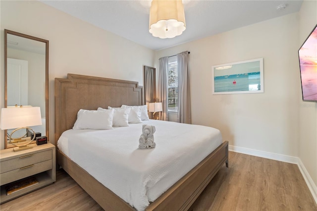 bedroom with light hardwood / wood-style floors