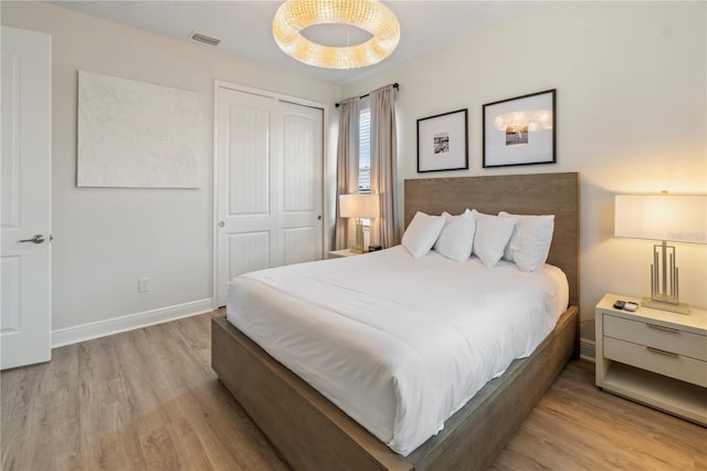 bedroom featuring a closet and light hardwood / wood-style floors