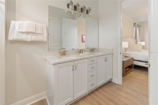 bathroom featuring vanity and hardwood / wood-style floors