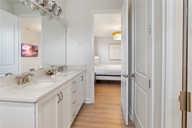 bathroom with vanity and hardwood / wood-style floors