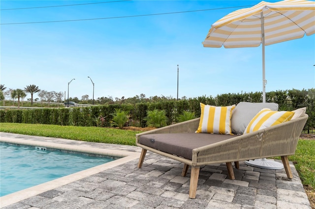 view of patio / terrace featuring a fenced in pool