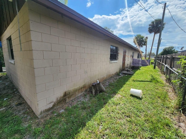 view of home's exterior featuring a yard