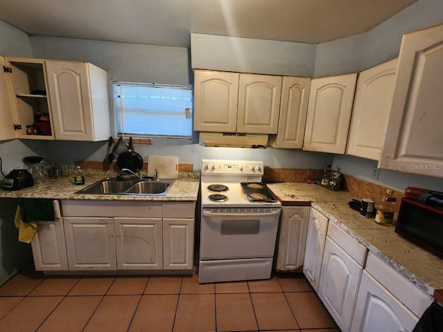 kitchen with light tile patterned floors, sink, and electric stove