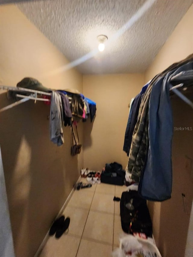 walk in closet featuring light tile patterned floors