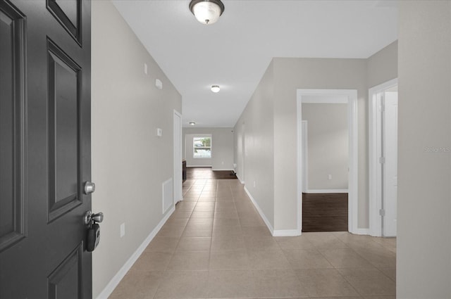 8064 Olive Brook Dr, Wesley Chapel, FL 33545 - hall with visible vents, baseboards, and light tile patterned flooring
