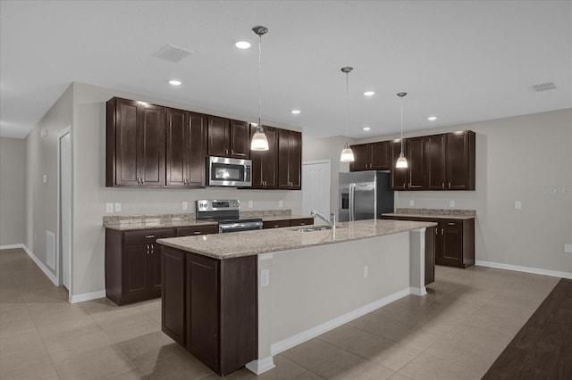 8064 Olive Brook Dr, Wesley Chapel, FL 33545 - kitchen featuring dark brown cabinets, recessed lighting, visible vents, and stainless steel appliances
