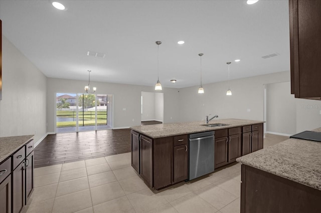 8064 Olive Brook Dr, Wesley Chapel, FL 33545 - kitchen featuring visible vents, a center island with sink, a sink, dark brown cabinetry, and dishwasher