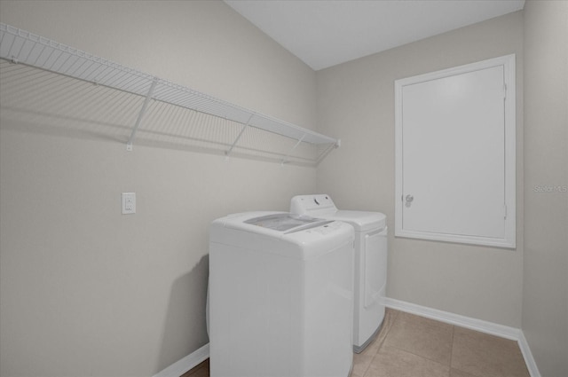8064 Olive Brook Dr, Wesley Chapel, FL 33545 - laundry area featuring laundry area, light tile patterned flooring, washing machine and dryer, and baseboards