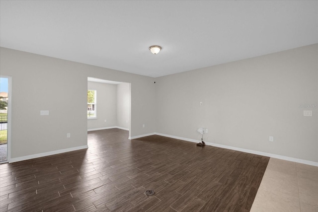 8064 Olive Brook Dr, Wesley Chapel, FL 33545 - spare room featuring dark wood-style floors and baseboards