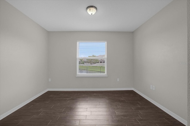 8064 Olive Brook Dr, Wesley Chapel, FL 33545 - spare room featuring dark wood finished floors and baseboards