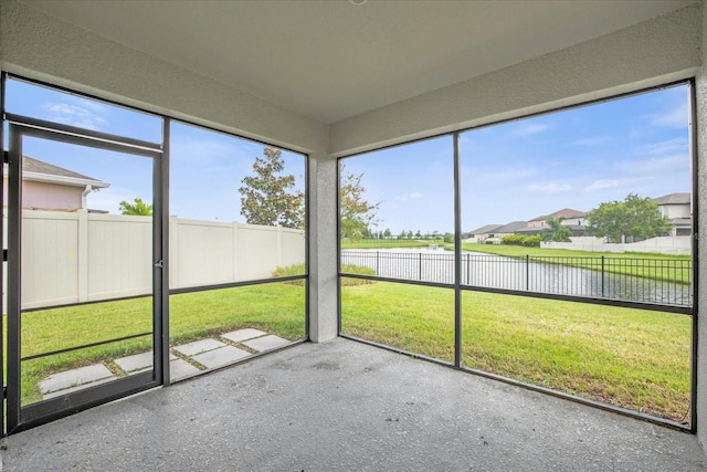 8064 Olive Brook Dr, Wesley Chapel, FL 33545 - unfurnished sunroom with a wealth of natural light and a water view