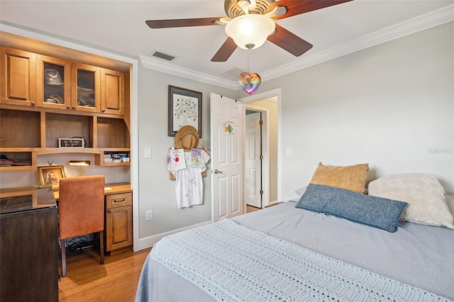 bedroom featuring light wood-type flooring, ceiling fan, and ornamental molding