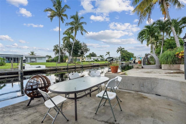 view of patio with a water view