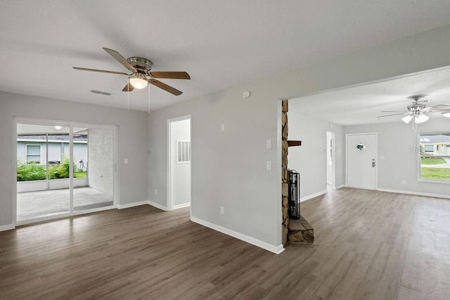 unfurnished room with ceiling fan and dark hardwood / wood-style floors