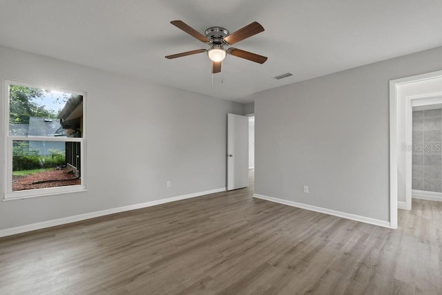 spare room featuring ceiling fan and wood-type flooring