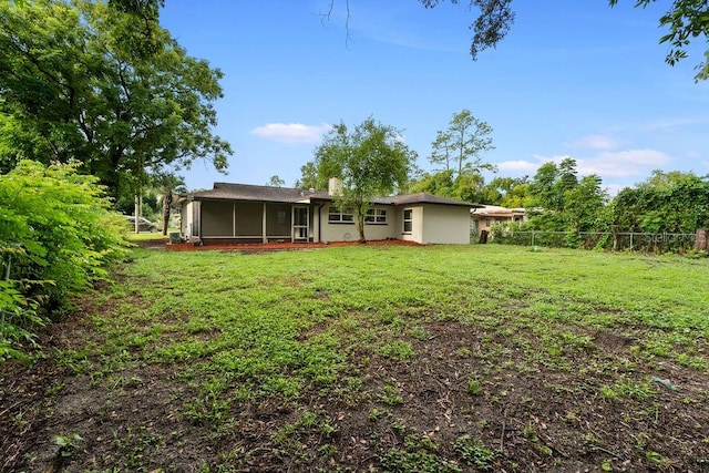 view of yard featuring a sunroom