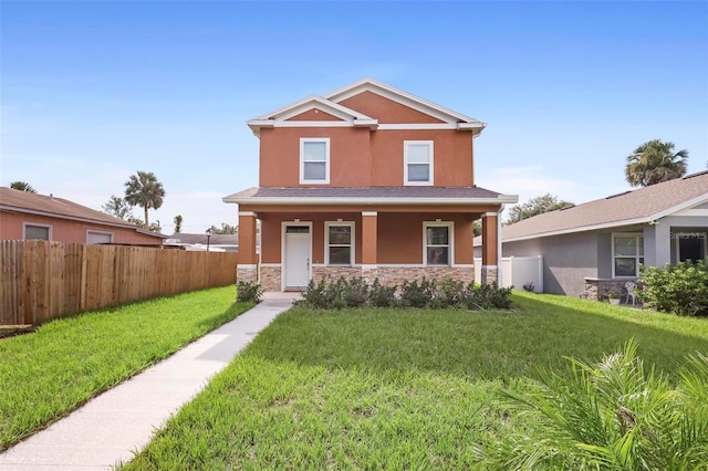 view of front of property with a front yard and covered porch