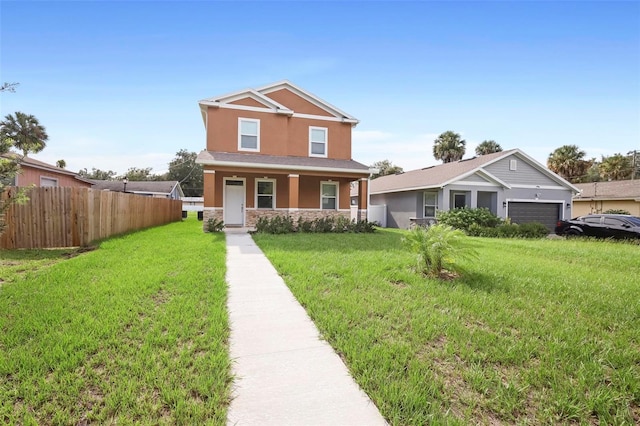 craftsman-style home featuring a garage, a front lawn, and covered porch