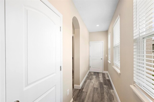 corridor featuring dark hardwood / wood-style flooring