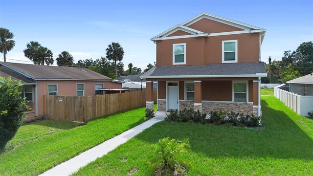 view of front of property with a front lawn and a porch