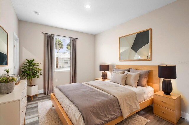 bedroom with hardwood / wood-style floors